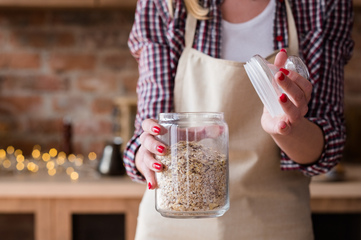 Holding a jar of porridge oats
