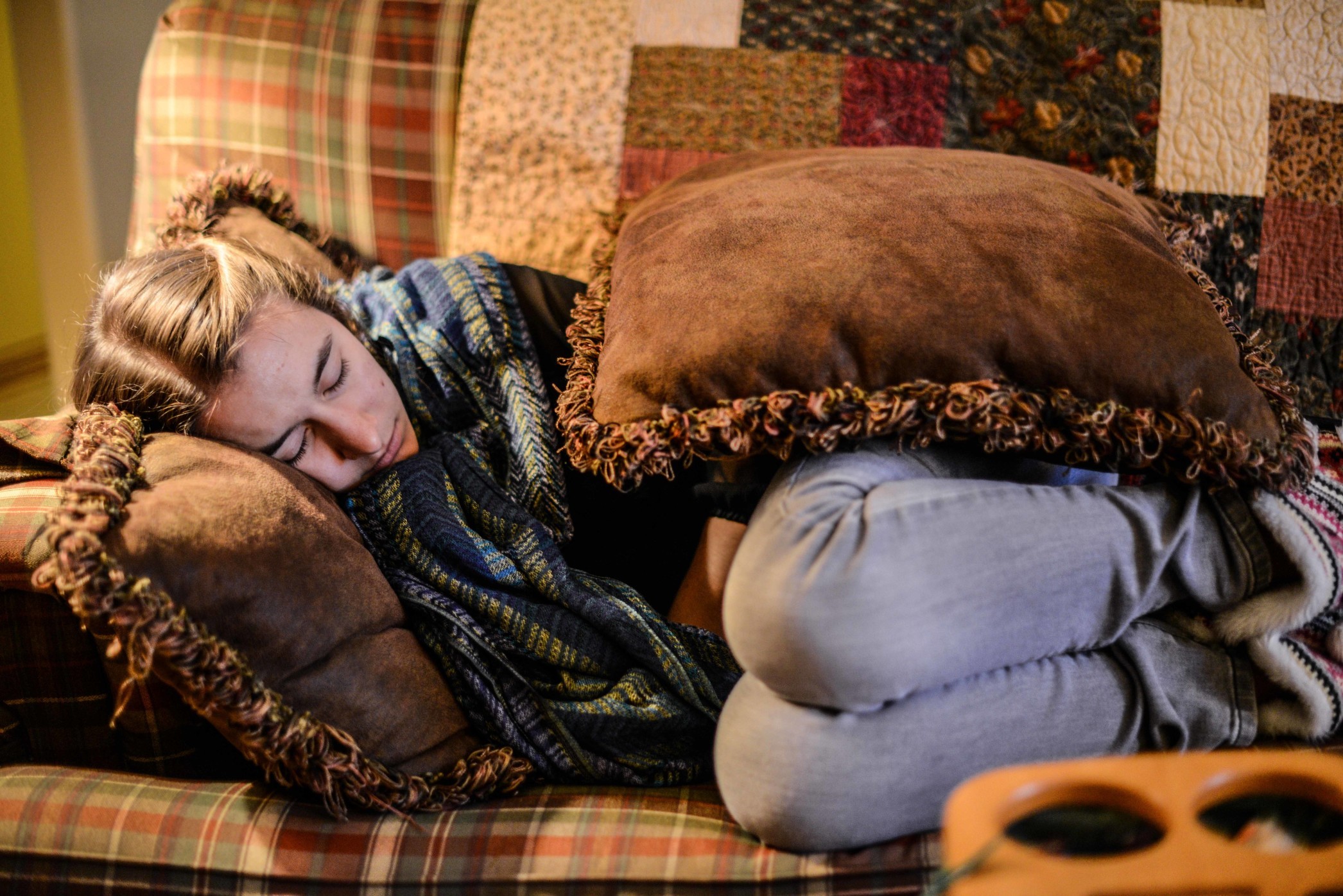 Young person sleeping on a friends couch