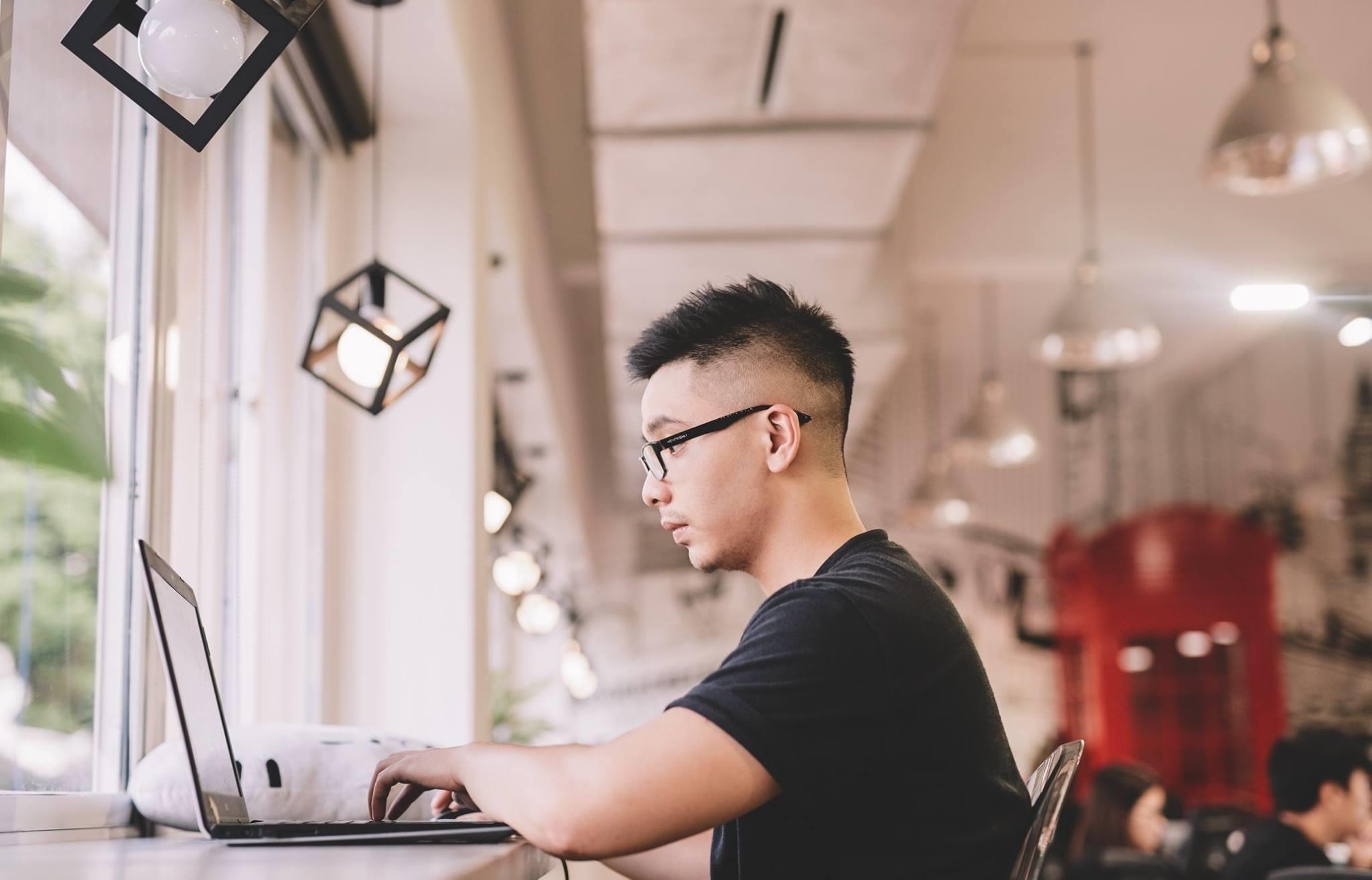 Young teacher on a laptop studying