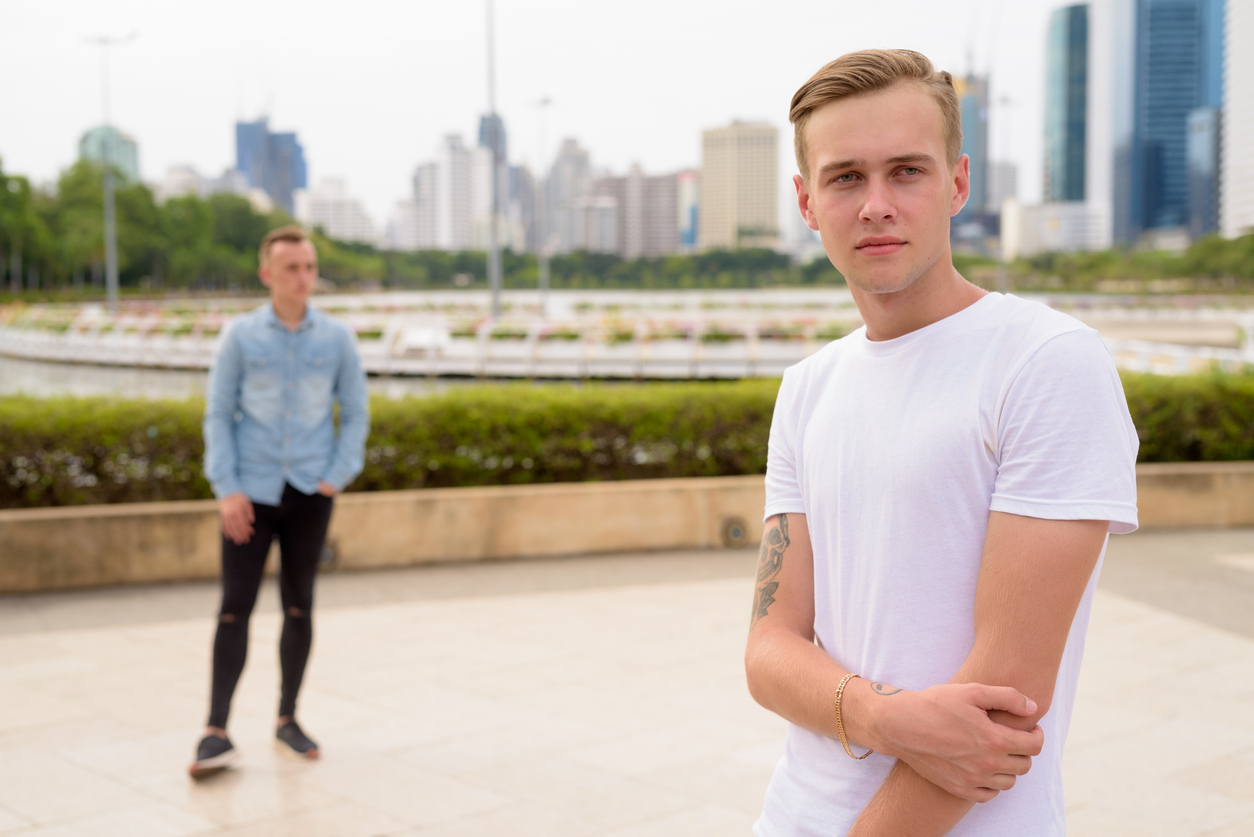 Couple-standing-far-apart