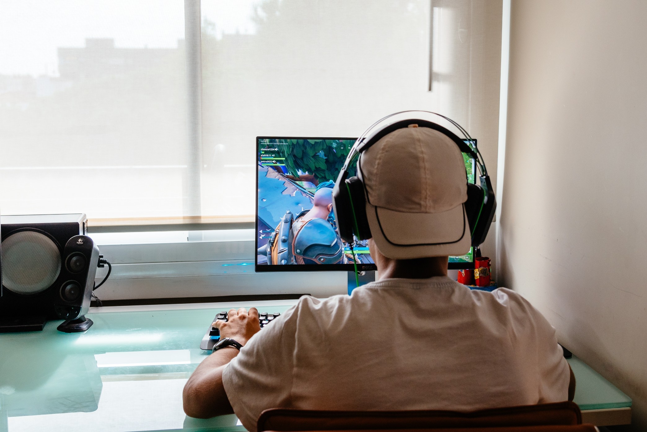 Teenager playing fortnite video game on pc domestic fortnite headphones lifestyles pc addiction t20 6mp N92